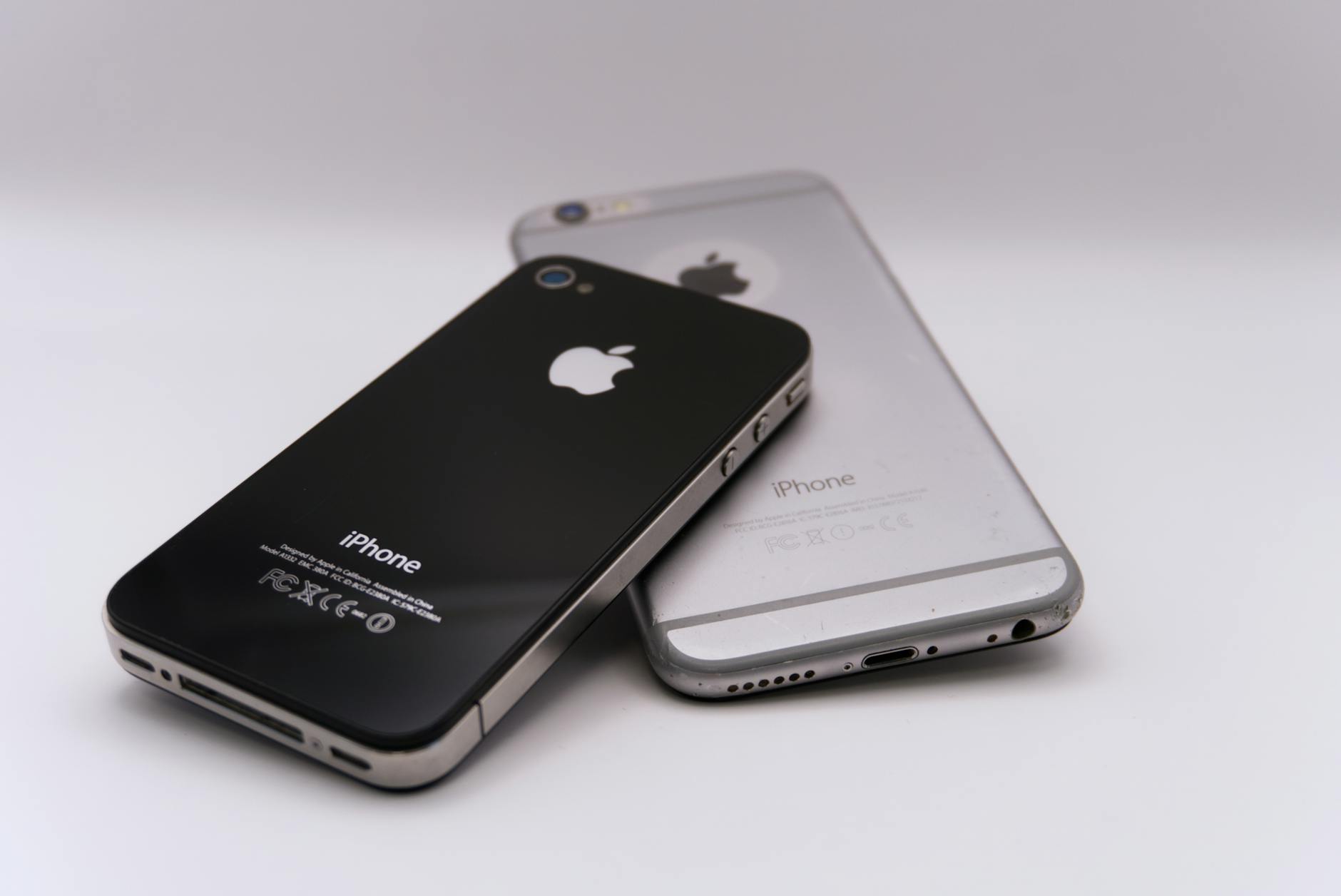 Two smartphones displayed on a white surface, showcasing modern technology.