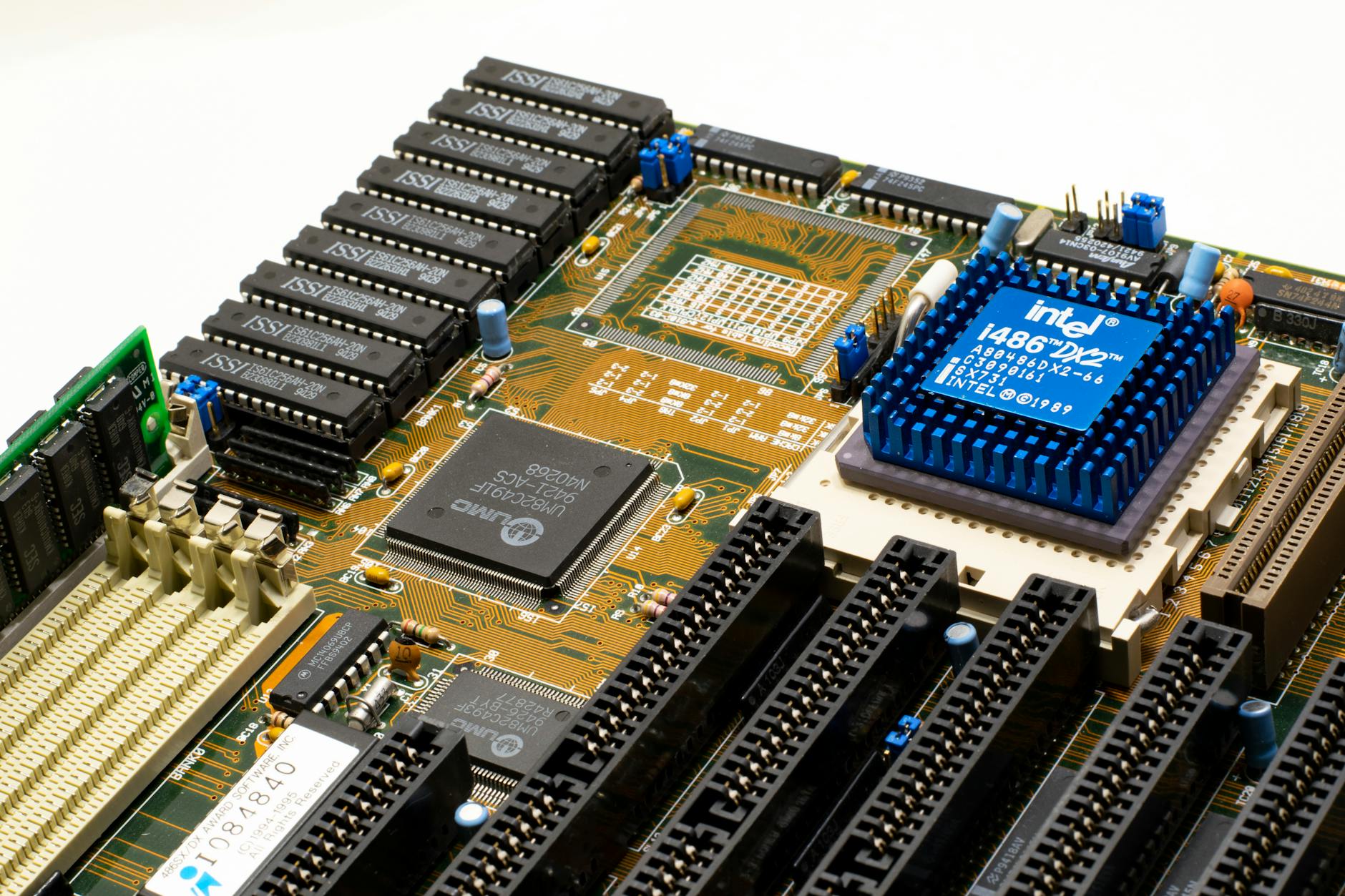 Close-up of vintage Intel 486DX2 CPU on a classic motherboard with electronic components.