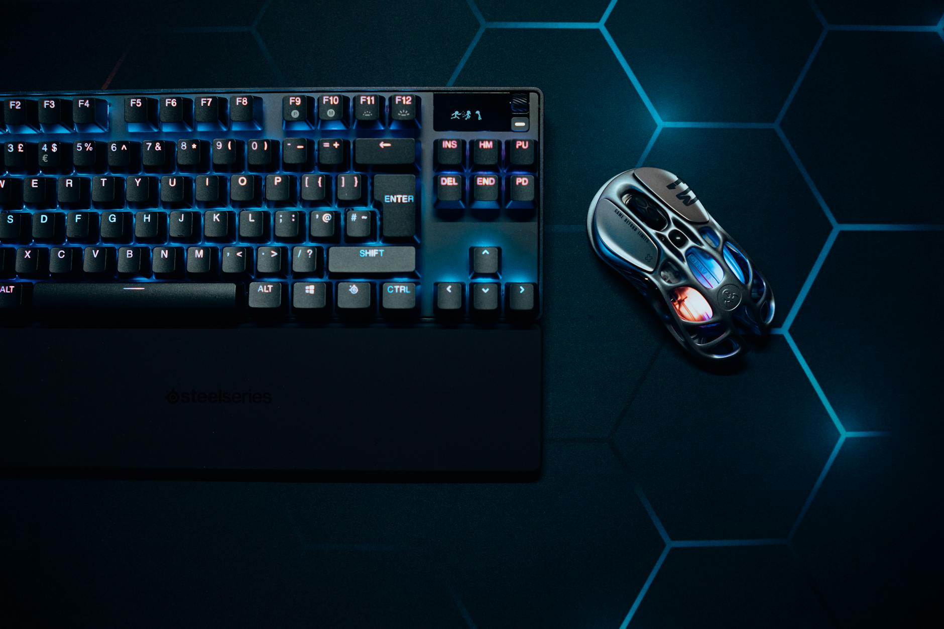 Stylish RGB gaming keyboard and mouse with vibrant lighting, perfect for tech enthusiasts.