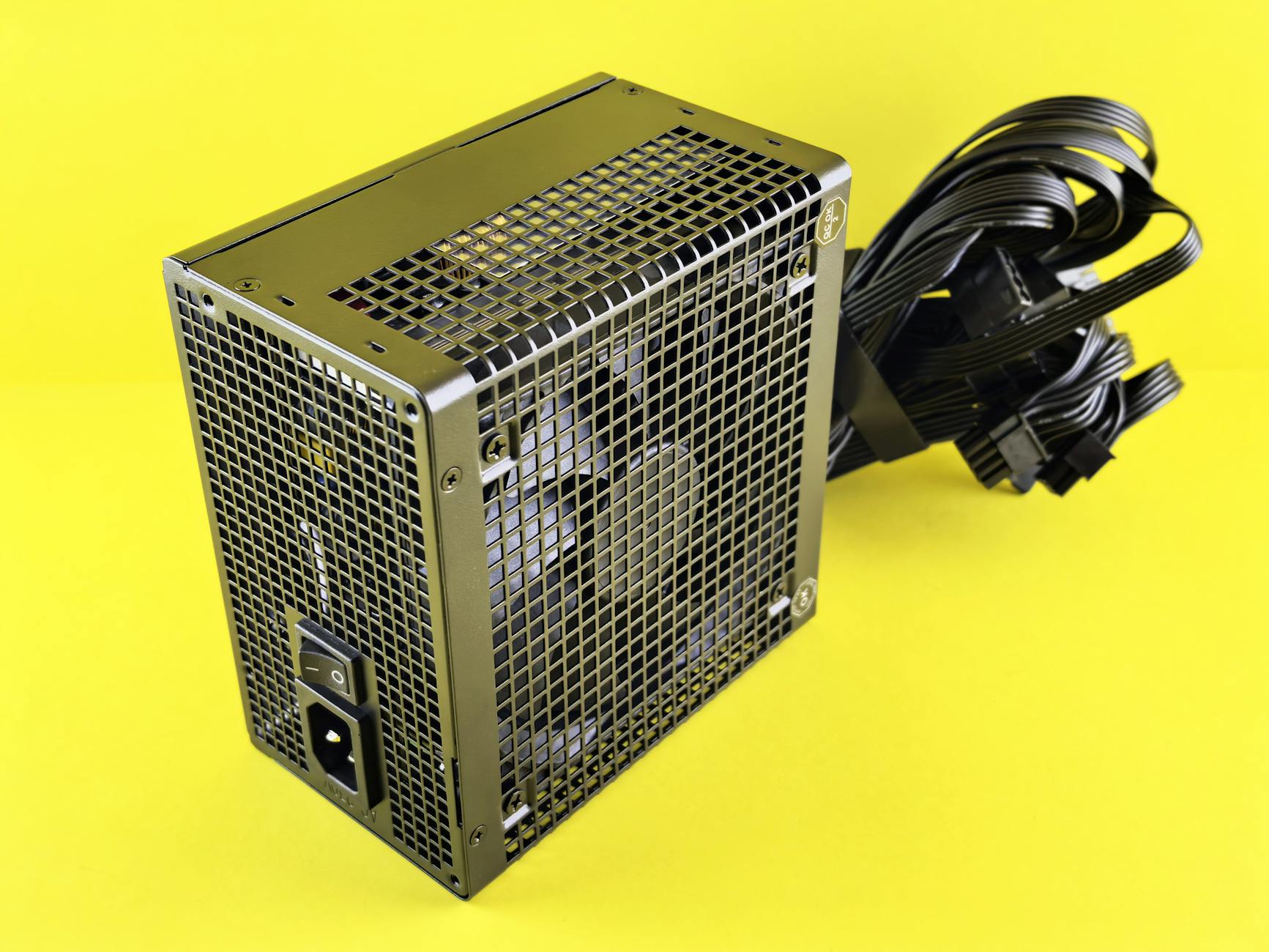 A powerful gaming PSU on yellow background, ideal for desktop setups.