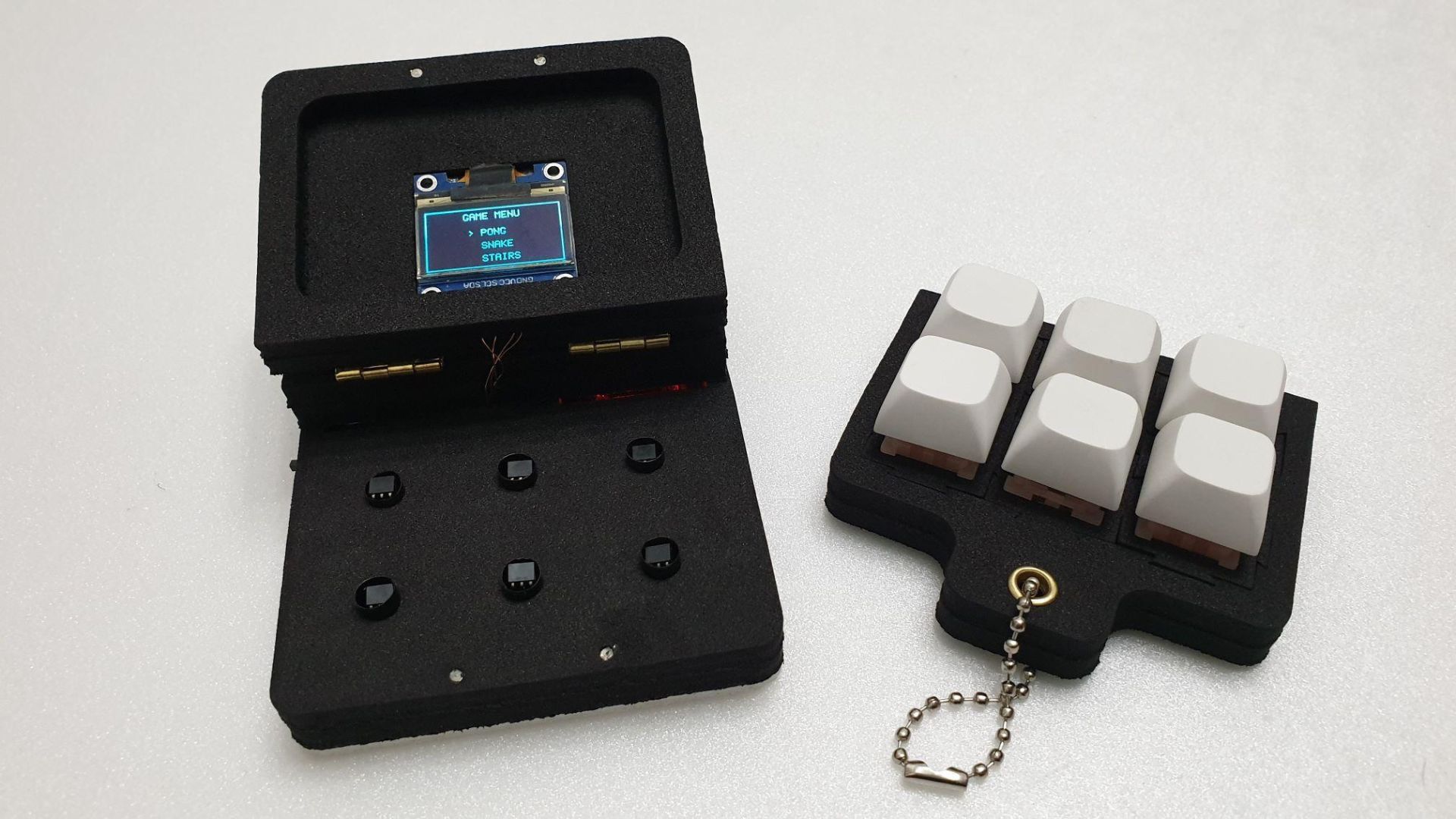 The GameBox Clicker: A Tiny, Modular Game Console Built From a Fidget Toy